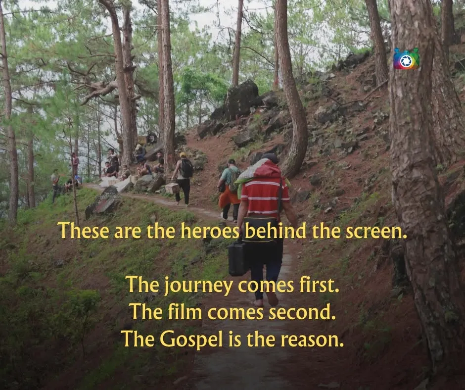 These are the heroes behind the screen: the journey comes first, the film comes second, the Gospel is the reason — the team hiking equipment up a forest trail to reach the village